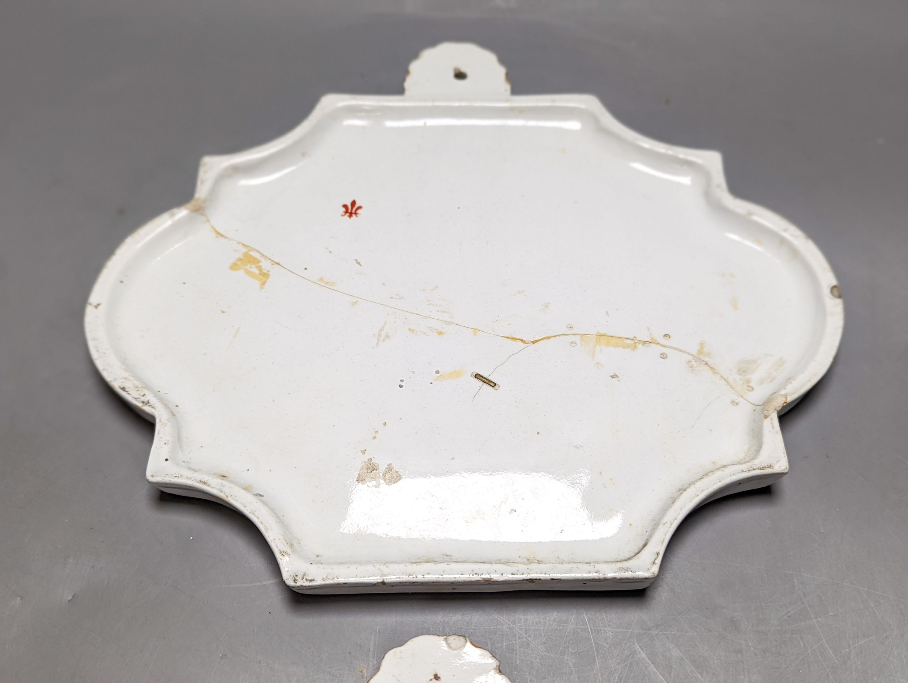 A pair of 19th century painted faience plaques in the style of Veuve Perrin 23cm